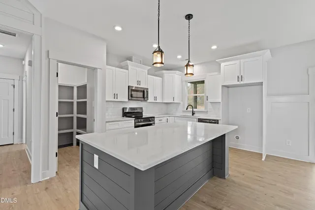 a view of an empty room with windows