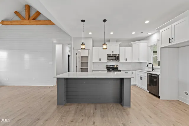 a view of a kitchen with a sink