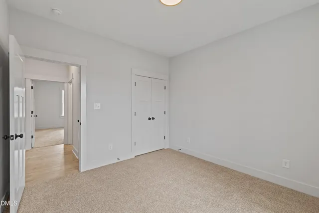 a kitchen with microwave a stove and a white cabinets