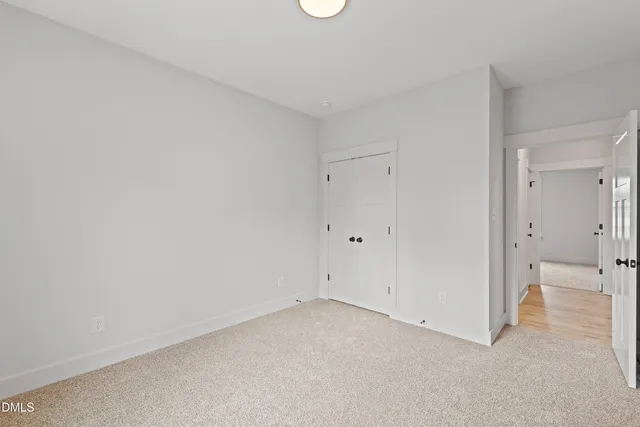 a bathroom with a sink a toilet and a large mirror