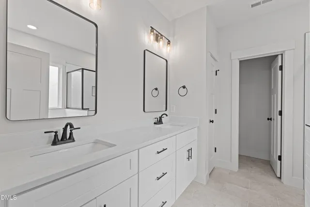 a view of a room with a ceiling fan and window