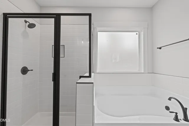 a bathroom with double sink and a mirror