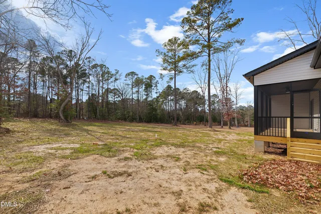 a house with trees in the background
