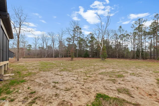 a big house with palm trees in front of it