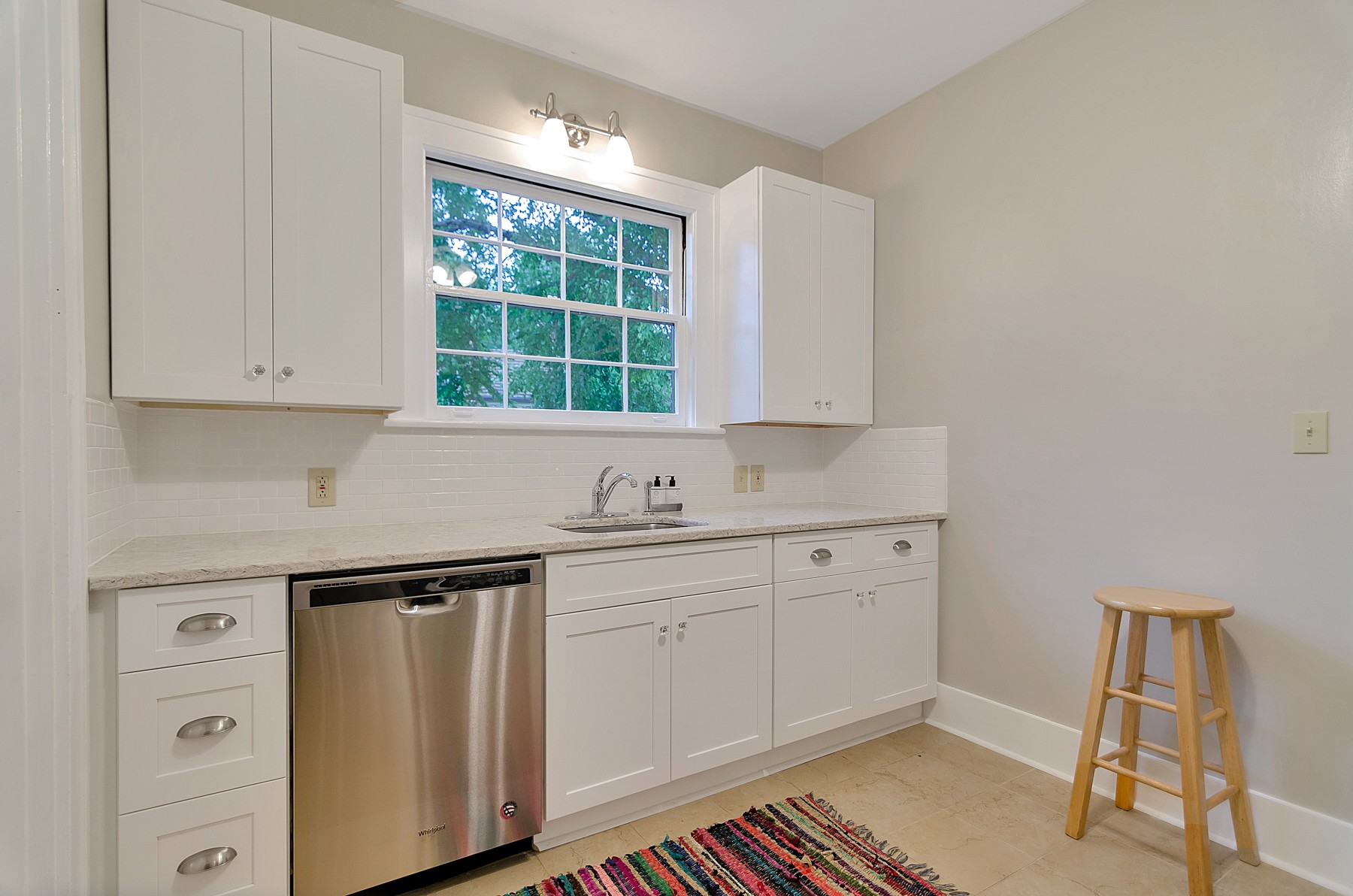 115 Cherokee Road Nashville, TN 37205 - Photo 15 of 36 a kitchen with a sink cabinets and window