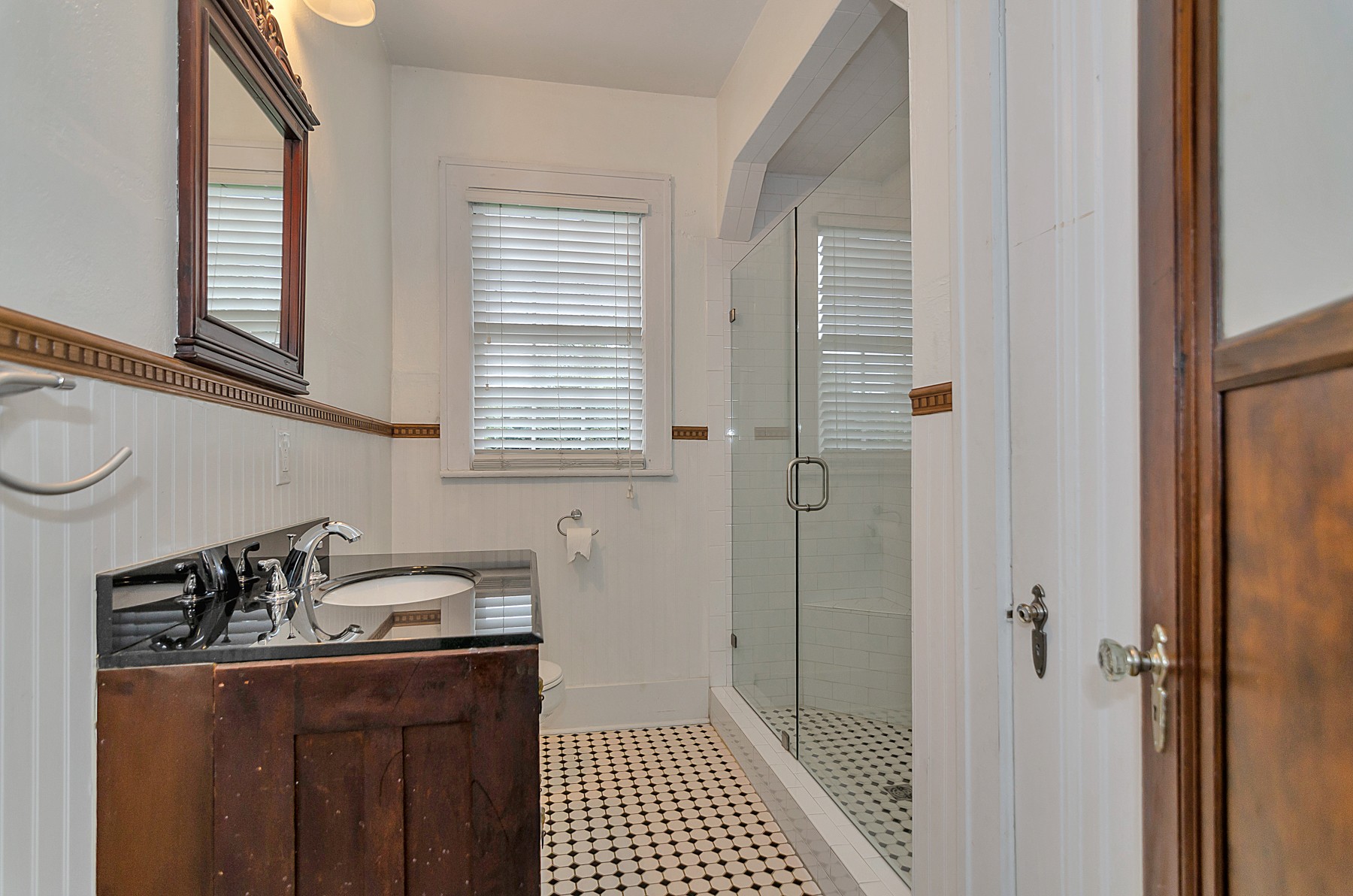 115 Cherokee Road Nashville, TN 37205 - Photo 17 of 36 a kitchen with a sink a refrigerator and cabinets