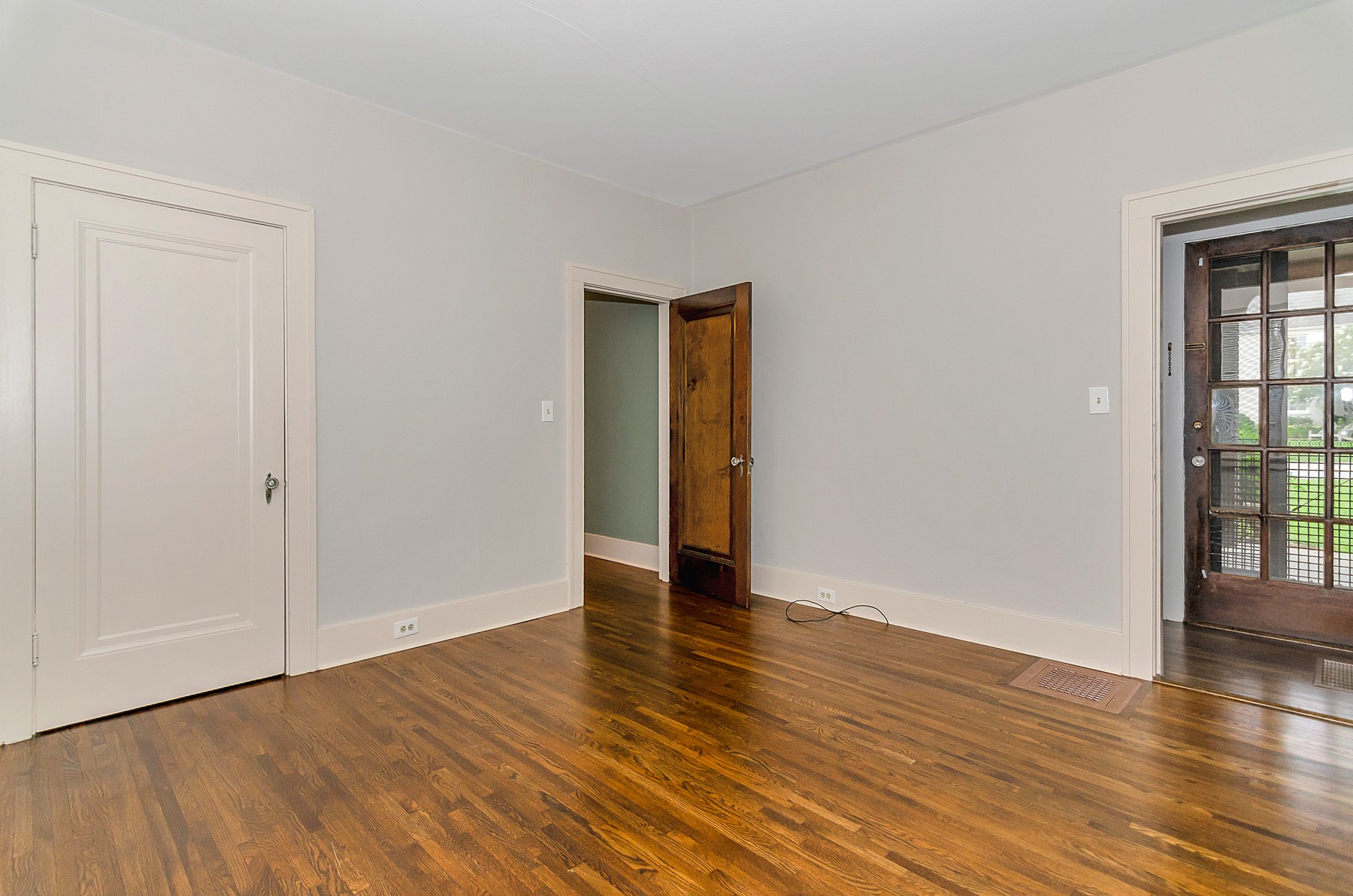115 Cherokee Road Nashville, TN 37205 - Photo 20 of 36 a view of an empty room with wooden floor and a window