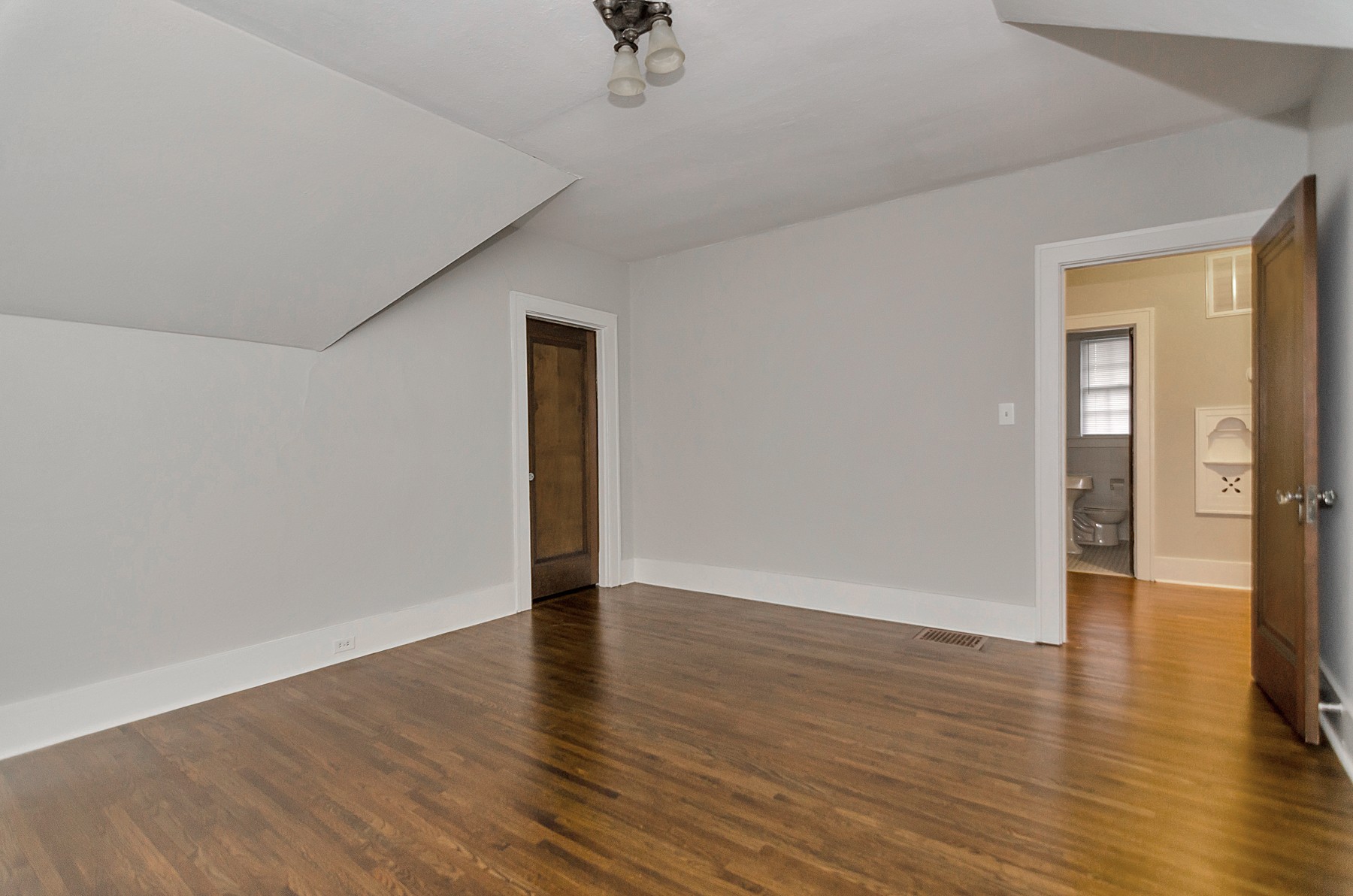 115 Cherokee Road Nashville, TN 37205 - Photo 24 of 36 a view of an empty room with wooden floor