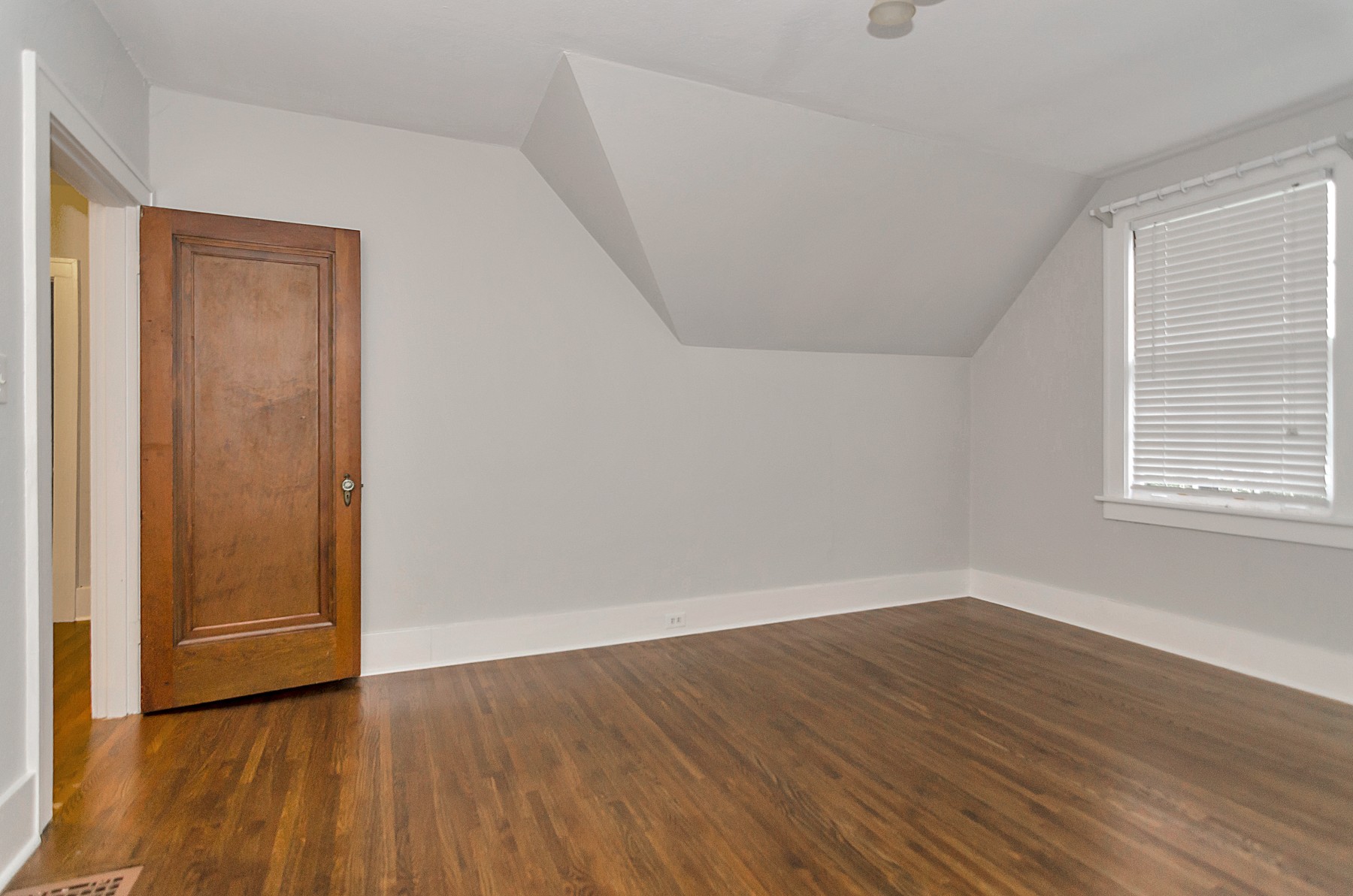 115 Cherokee Road Nashville, TN 37205 - Photo 25 of 36 a view of an empty room with wooden floor and a window