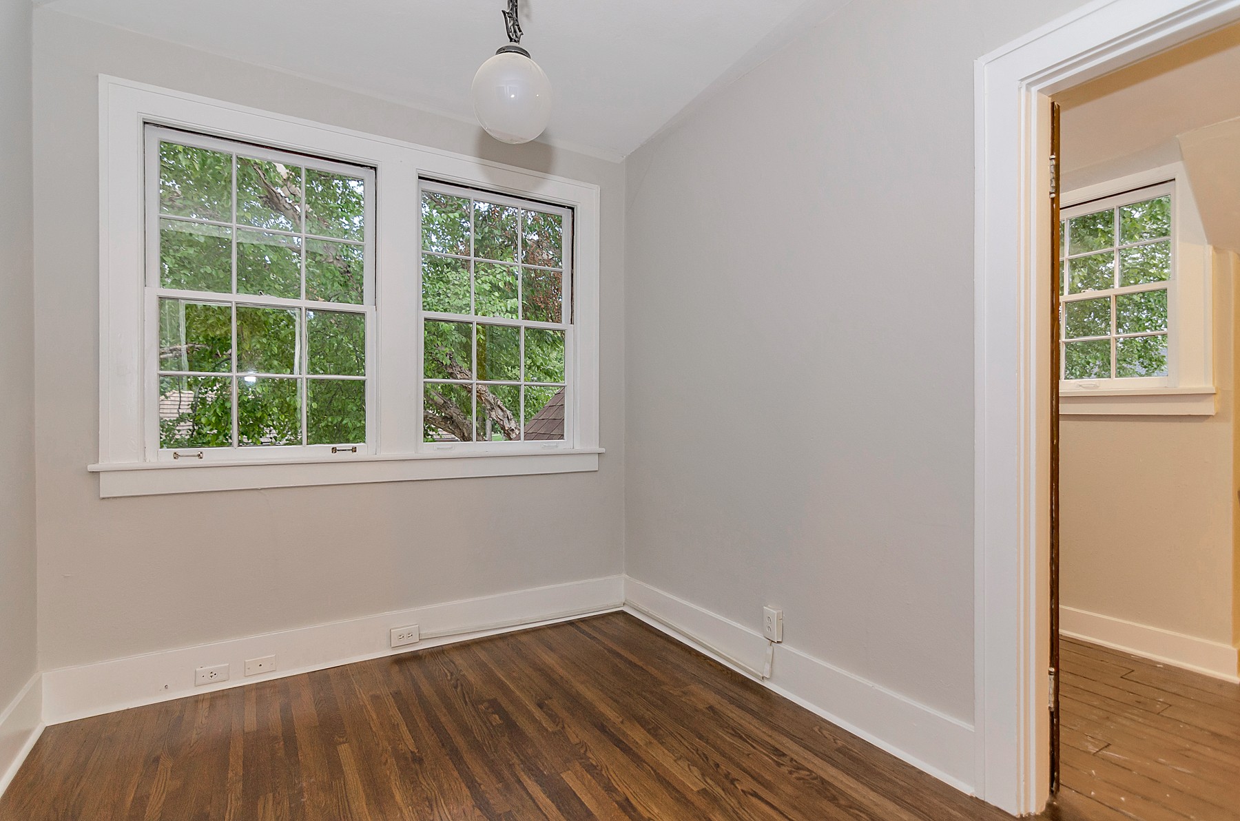 115 Cherokee Road Nashville, TN 37205 - Photo 27 of 36 a view of an empty room with wooden floor and a window