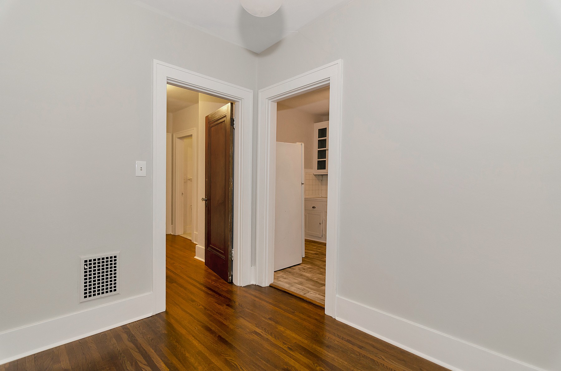 115 Cherokee Road Nashville, TN 37205 - Photo 30 of 36 a view of an empty room with wooden floor and a window