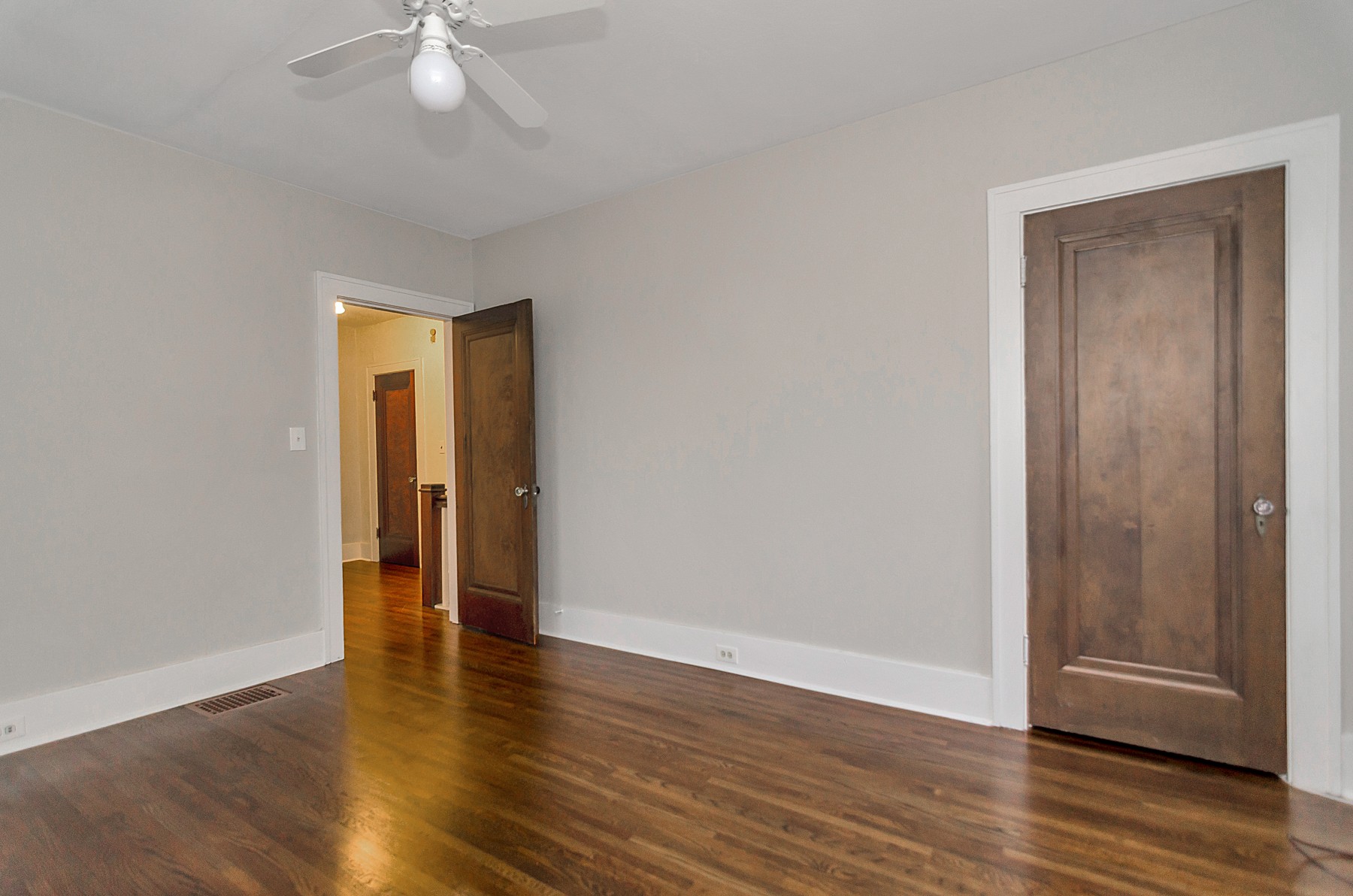 115 Cherokee Road Nashville, TN 37205 - Photo 35 of 36 an empty room with wooden floor and closet area
