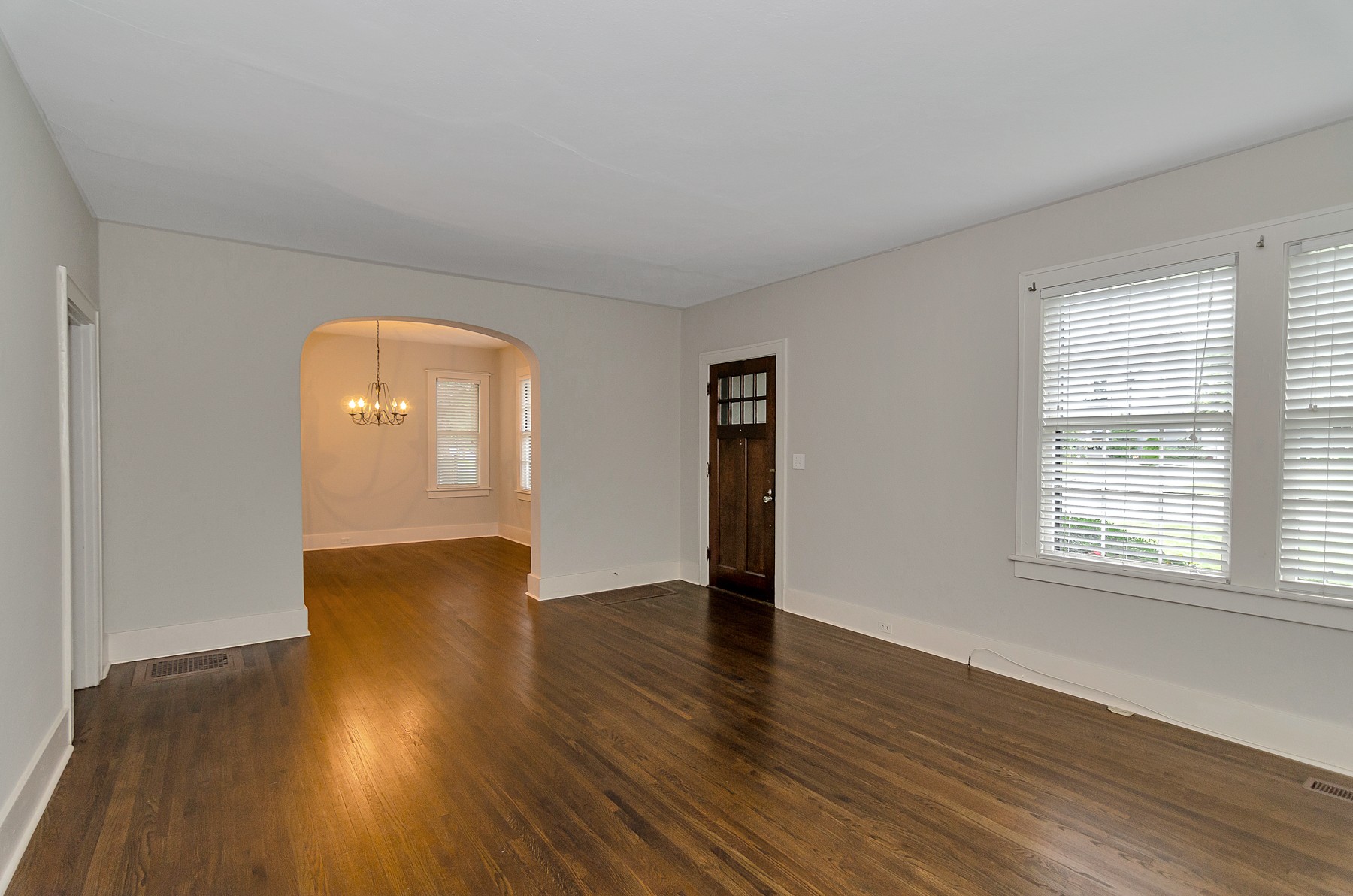 115 Cherokee Road Nashville, TN 37205 - Photo 6 of 36 an empty room with wooden floor and windows