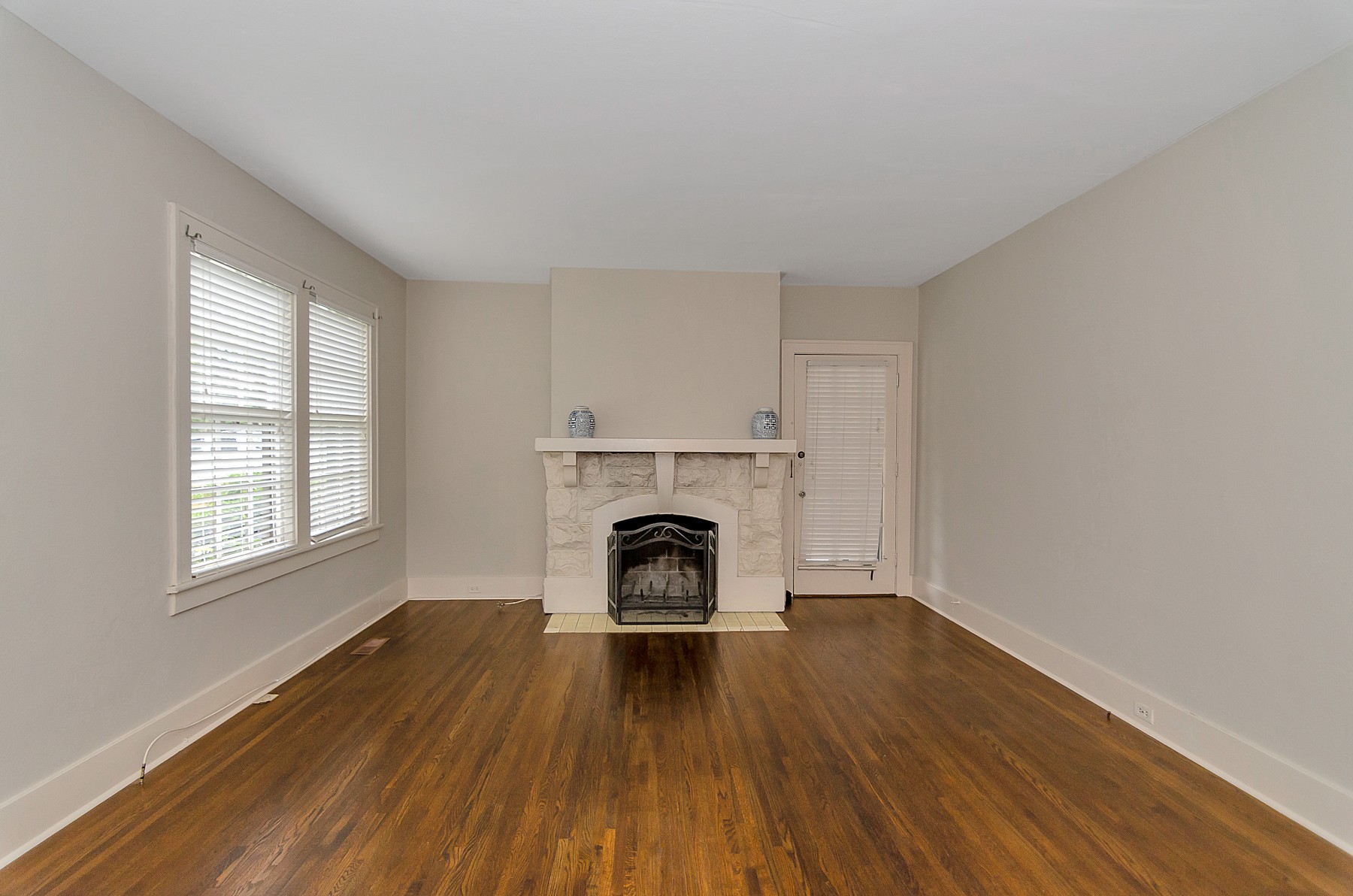 115 Cherokee Road Nashville, TN 37205 - Photo 7 of 36 an empty room with fireplace and wooden floor