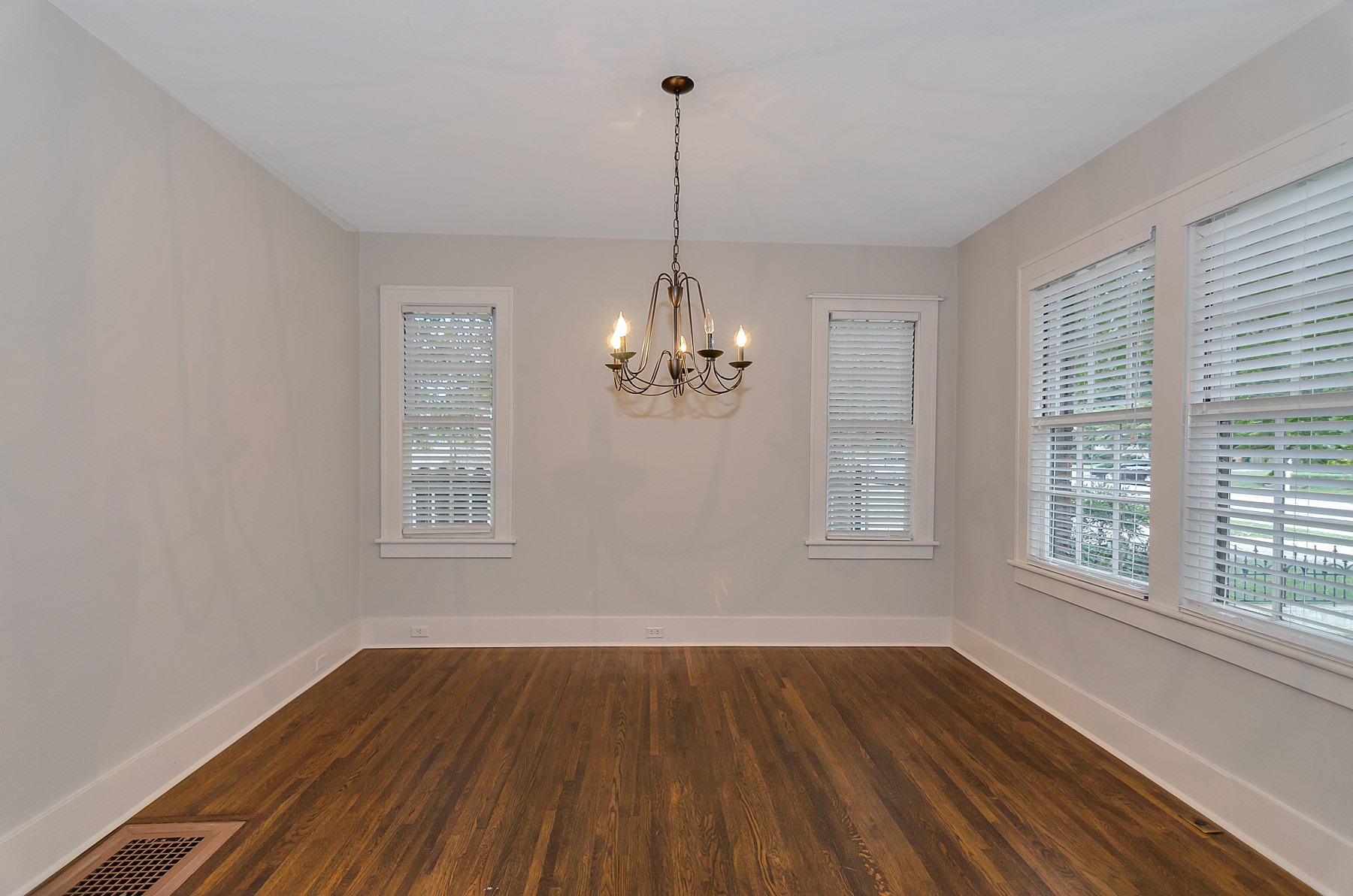 115 Cherokee Road Nashville, TN 37205 - Photo 10 of 36 a view of a room with wooden floor chandelier and windows