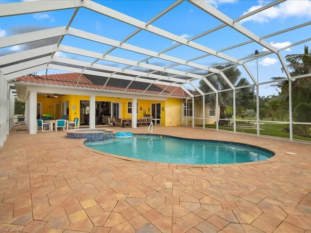 a view of a swimming pool with a patio