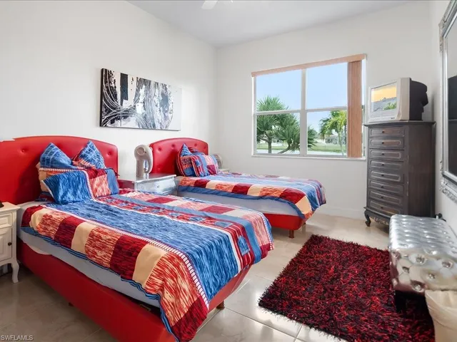 a bedroom with bed and window