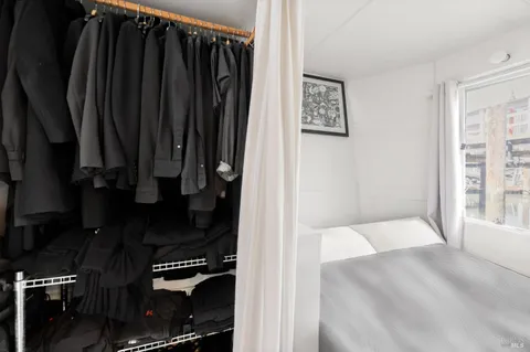 a view of living room with furniture and wooden floor