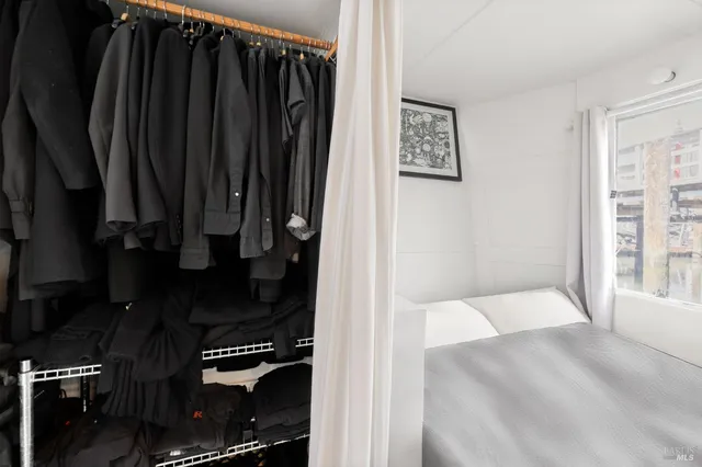 a view of living room with furniture and wooden floor