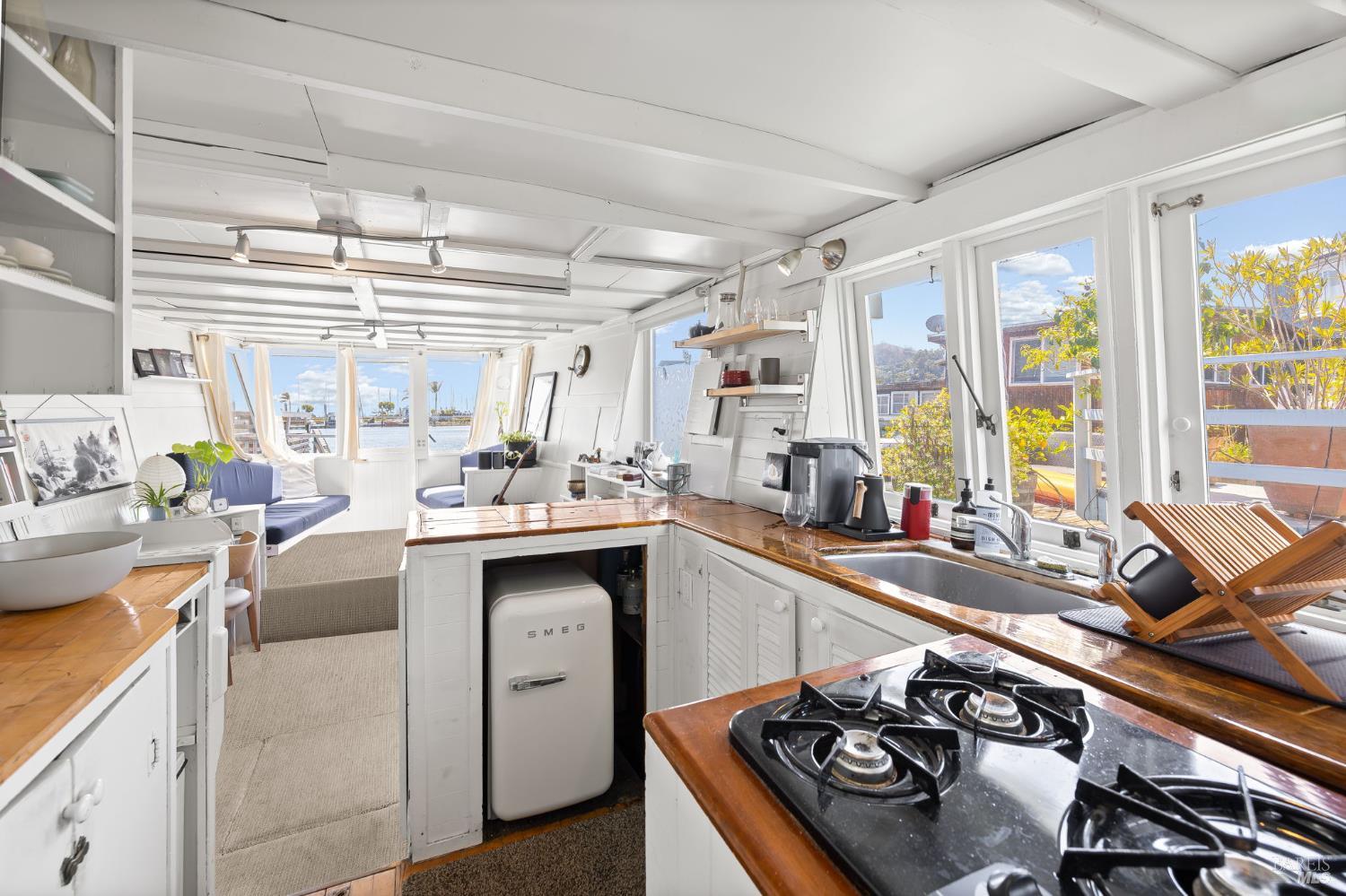 12 South 40 Dock Sausalito, CA 94965 - Photo 15 of 21 a kitchen with a sink stove and cabinets