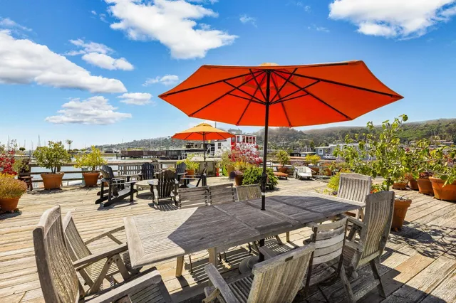an outdoor space with furniture patio and umbrella