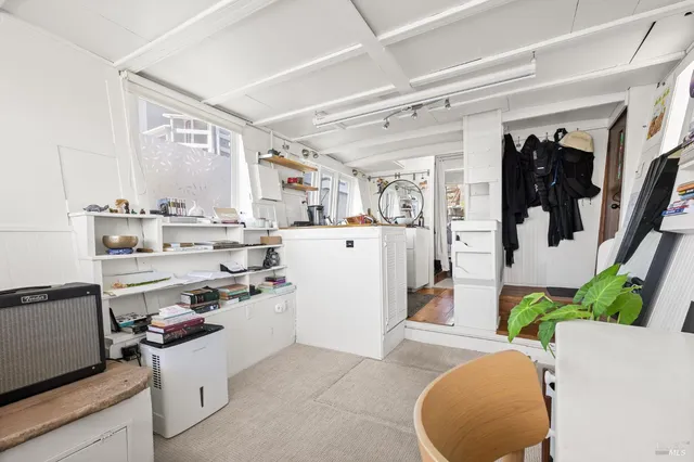 a kitchen with a sink appliances and cabinets