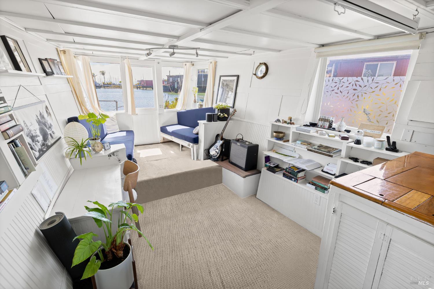 12 South 40 Dock Sausalito, CA 94965 - Photo 3 of 21 a living room with furniture and a potted plant