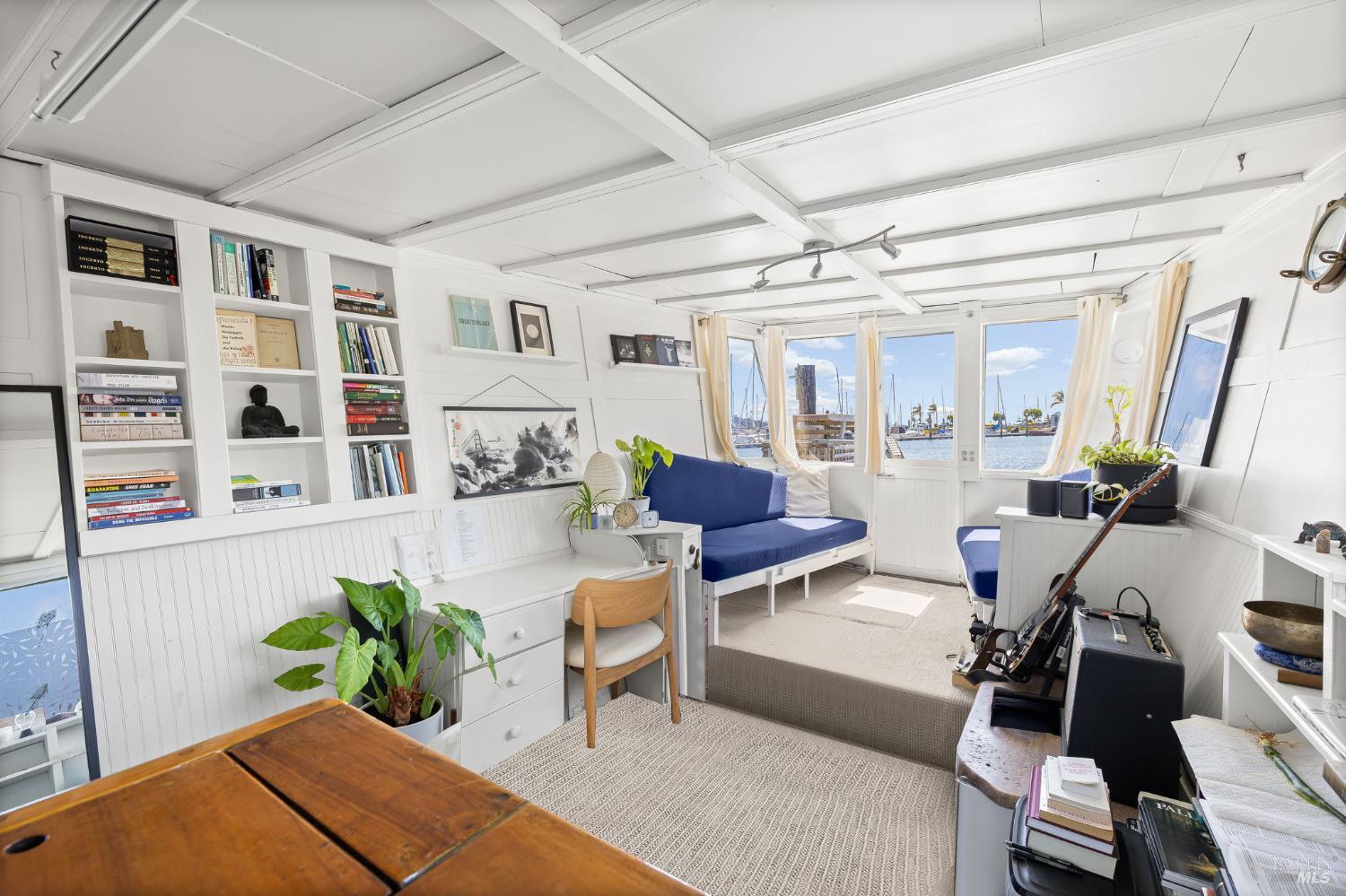 12 South 40 Dock Sausalito, CA 94965 - Photo 4 of 21 a living room with furniture potted plant and open kitchen view