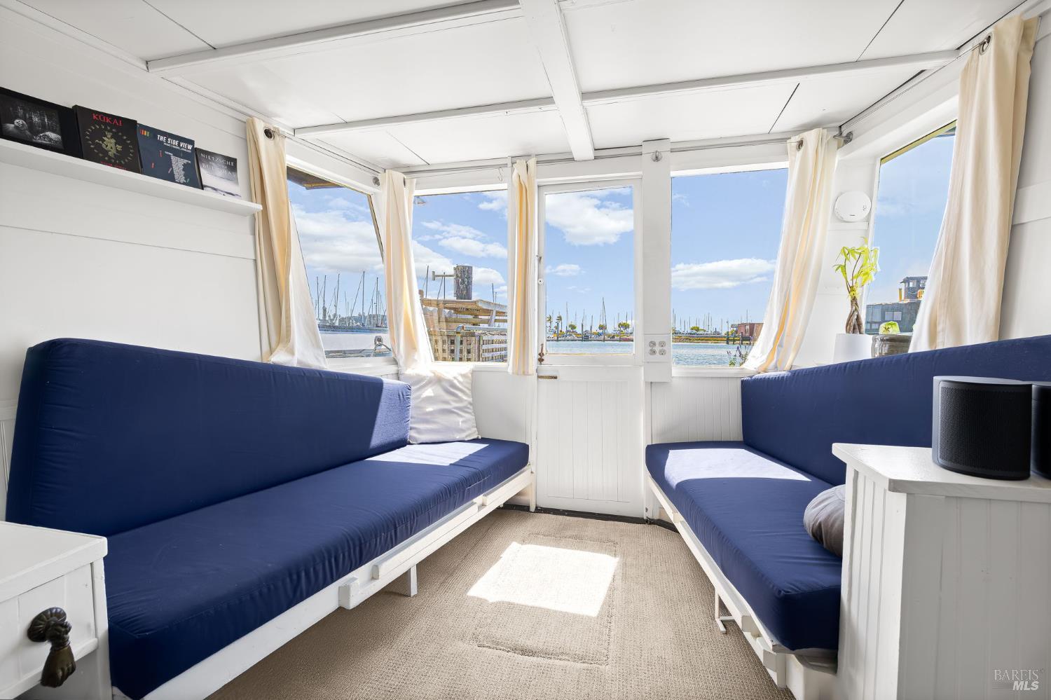 12 South 40 Dock Sausalito, CA 94965 - Photo 7 of 21 a living room with furniture and a flat screen tv