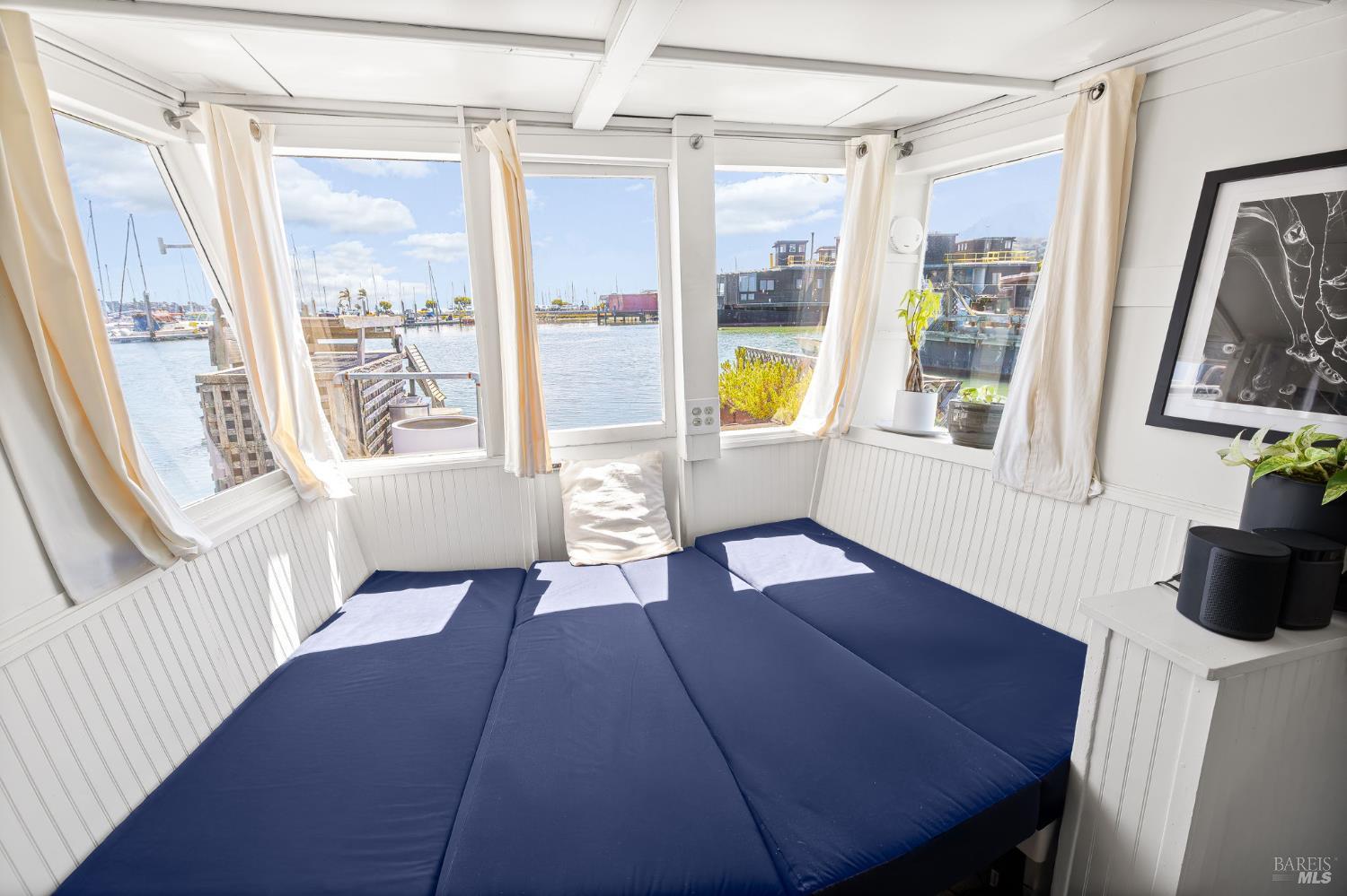 12 South 40 Dock Sausalito, CA 94965 - Photo 8 of 21 a view of a livingroom with furniture wooden floor and windows