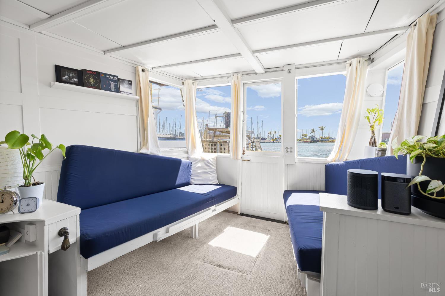 12 South 40 Dock Sausalito, CA 94965 - Photo 9 of 21 a living room with furniture and a window