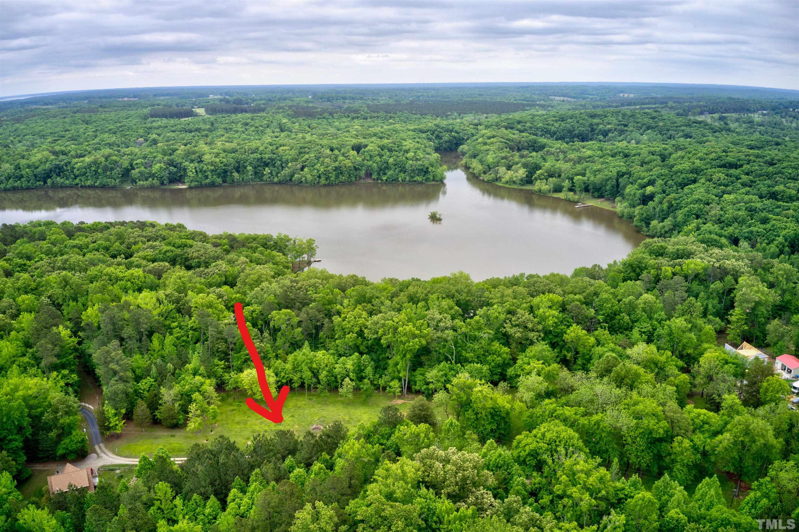 Ivy Hill Road Clarksville, VA 23927 - Photo 4 of 25 a view of a garden with a lake