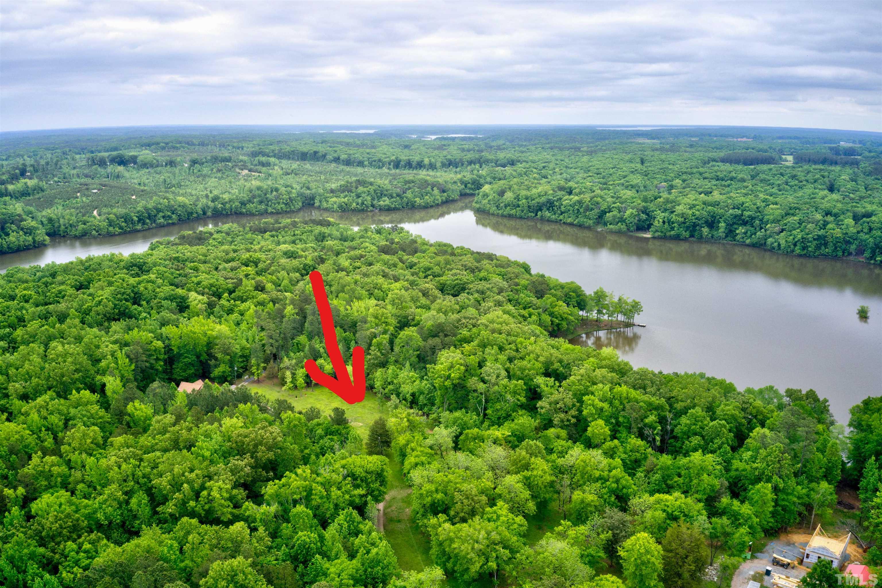 Ivy Hill Road Clarksville, VA 23927 - Photo 5 of 25 a view of a lake with a houses in the back