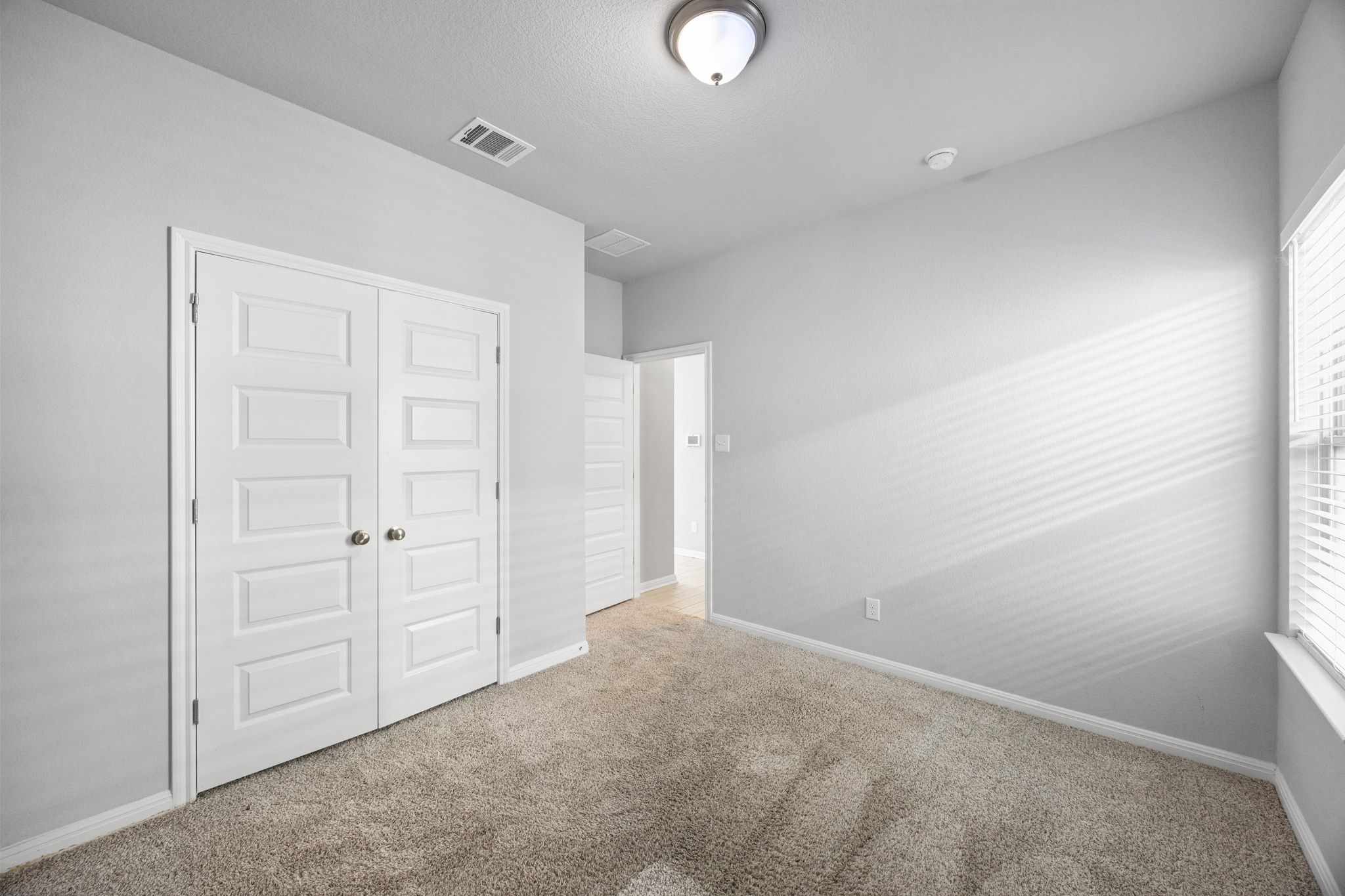 225 Unforgiven Lane Jarrell, TX 76537 - Photo 19 of 30 Unfurnished bedroom featuring carpet flooring and a closet