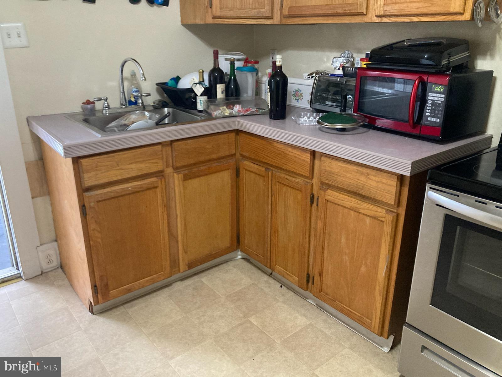 a kitchen with sink and cabinets