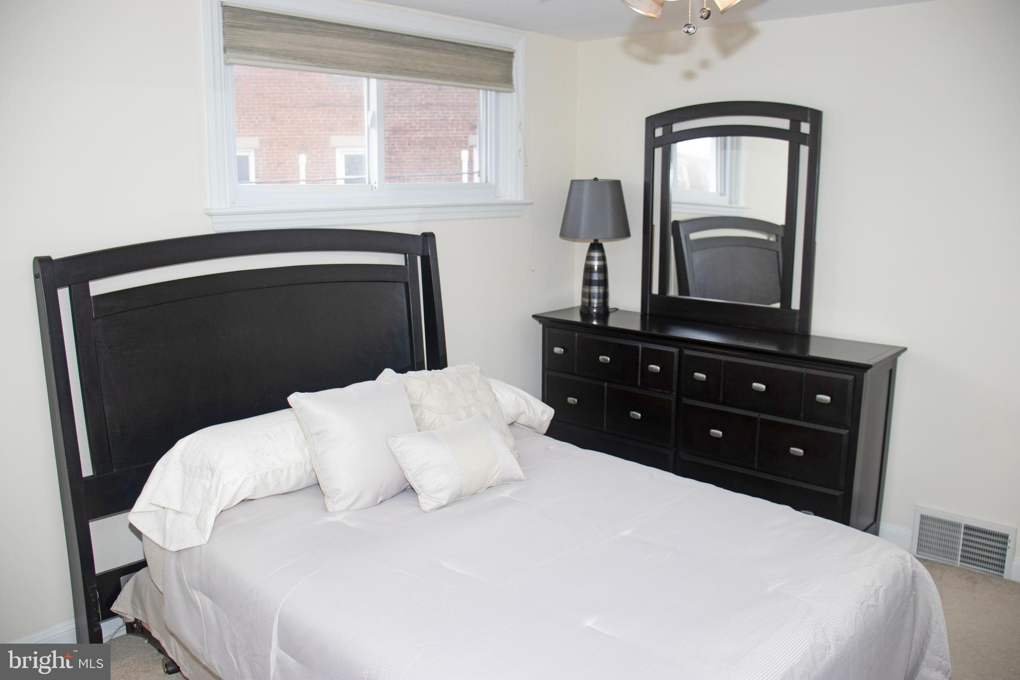 858 Fairfax Road Drexel Hill, PA 19026 - Photo 11 of 20 a bedroom with a bed and a dresser