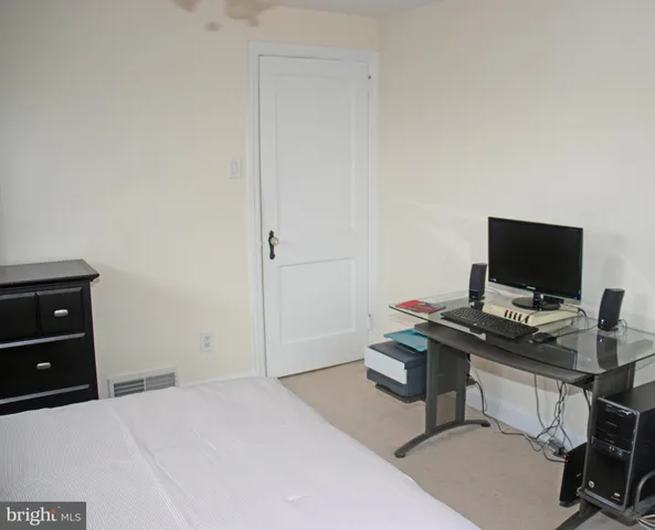 a view of a workspace with furniture