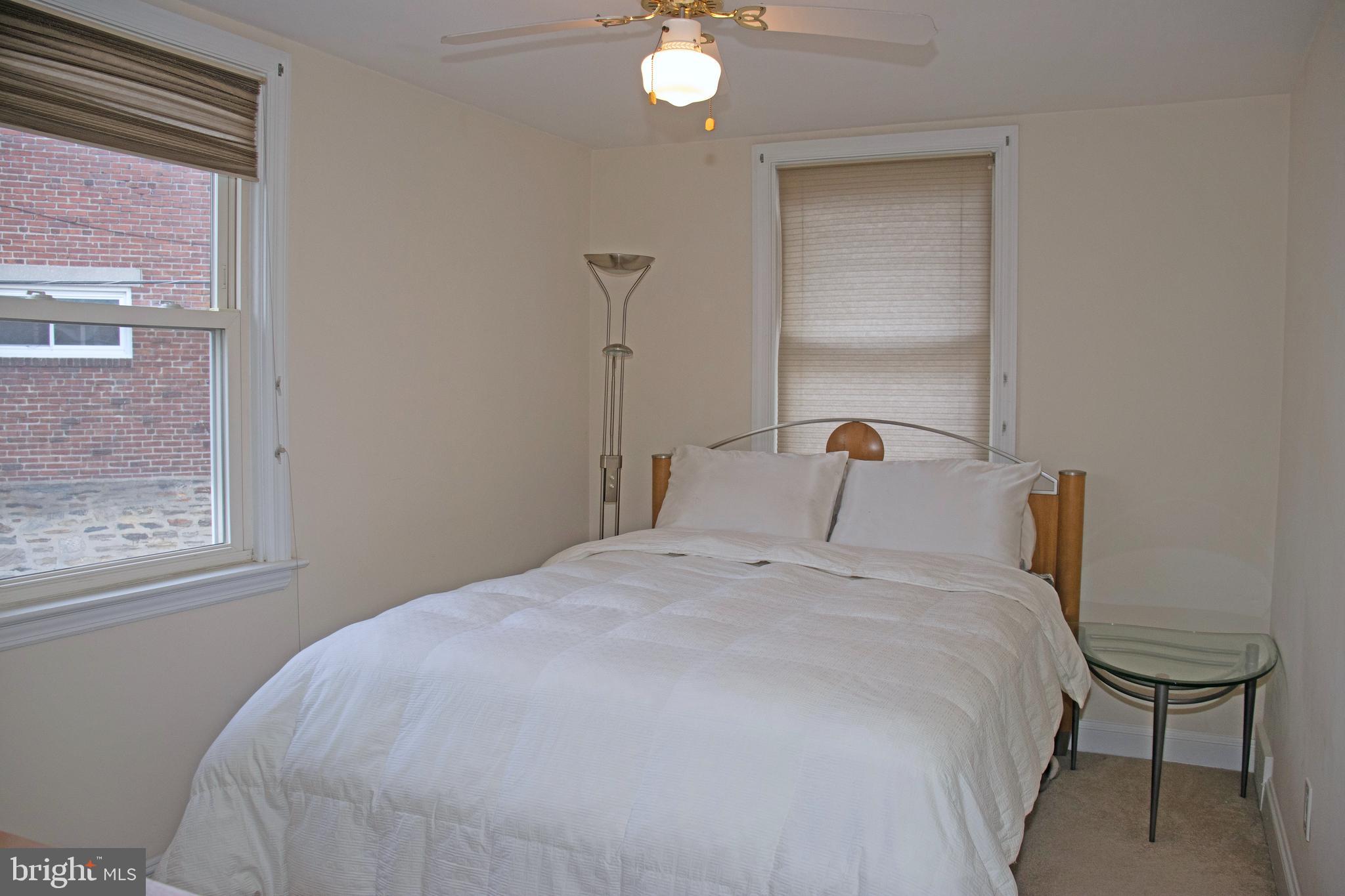858 Fairfax Road Drexel Hill, PA 19026 - Photo 15 of 20 a large bed sitting in a bedroom next to a window
