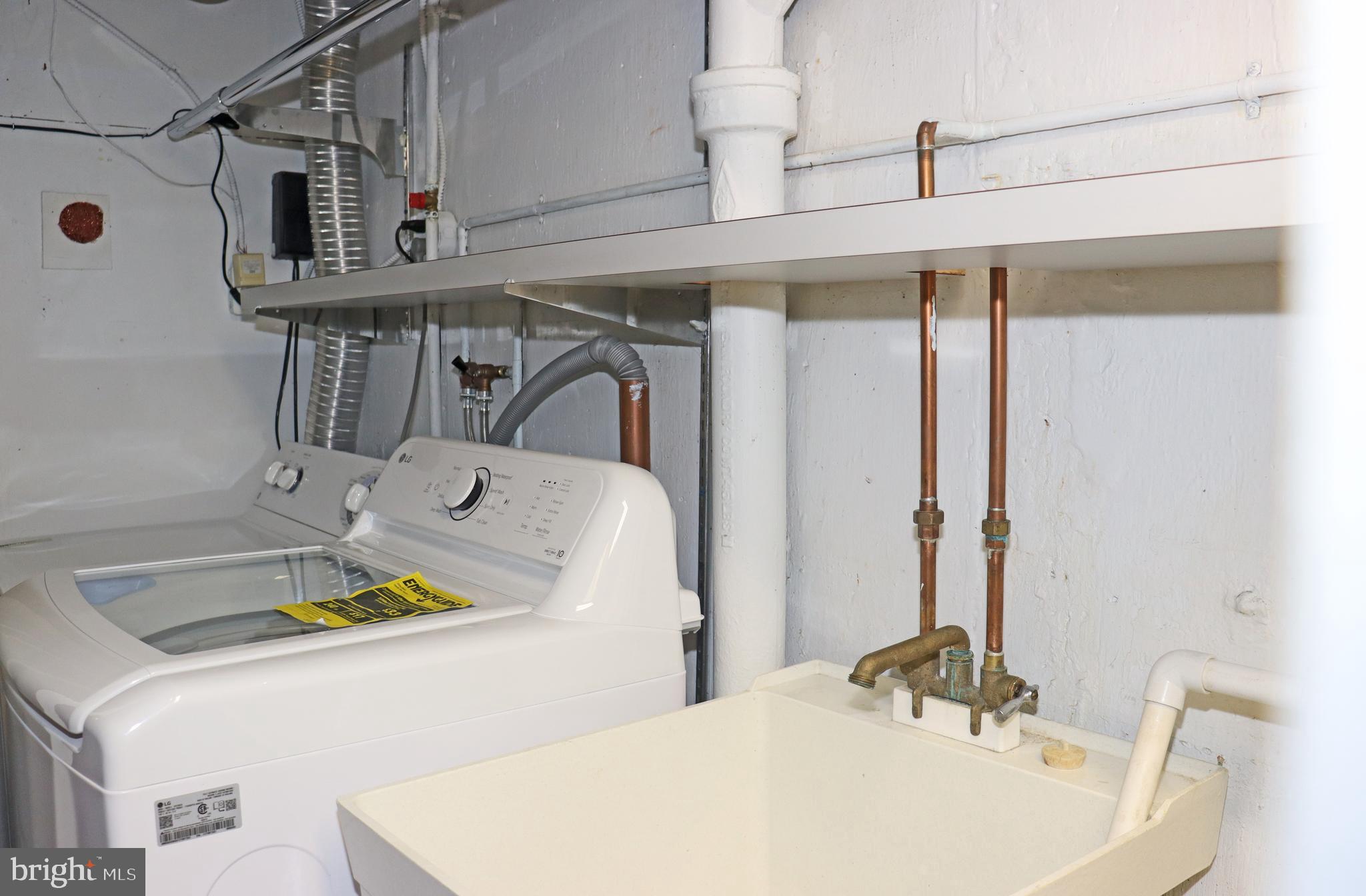 858 Fairfax Road Drexel Hill, PA 19026 - Photo 19 of 20 a bathroom with a sink a bathtub and a mirror