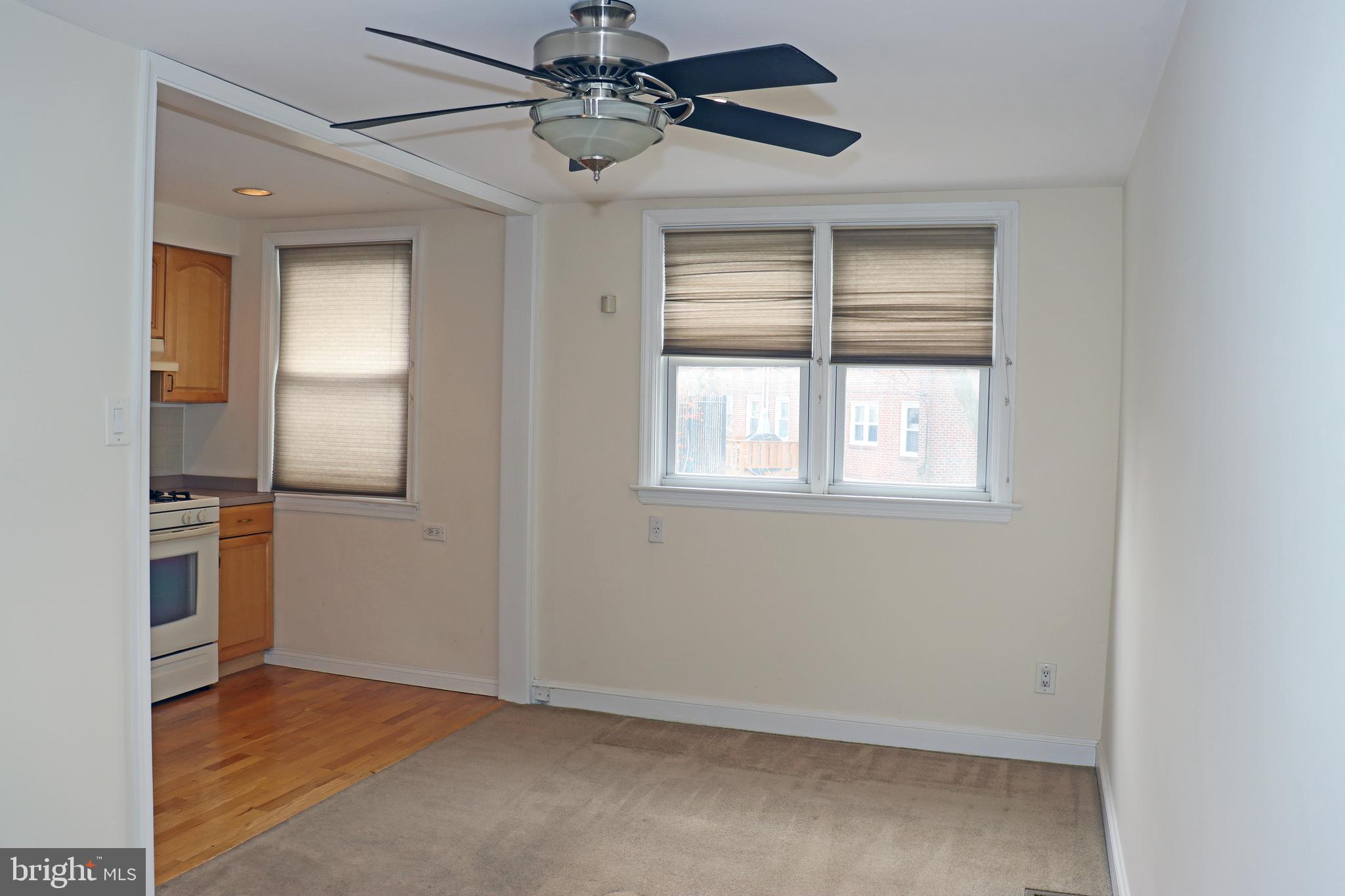 858 Fairfax Road Drexel Hill, PA 19026 - Photo 6 of 20 an empty room with windows and ceiling fan