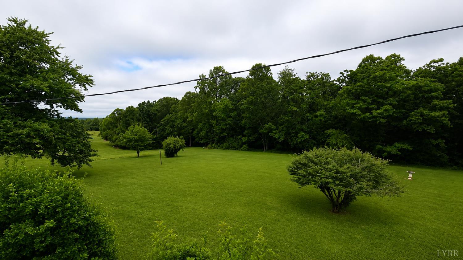 2346 Mitchell Mill Road Gladys, VA 24554 - Photo 29 of 38 a view of a flower garden with a lake view