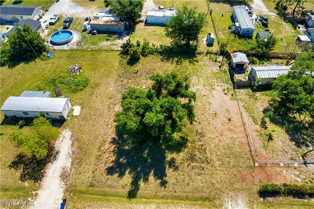 8355 Nault Road North Fort Myers, FL 33917 - Photo 6 of 8 an aerial view of a house with yard swimming pool and outdoor seating