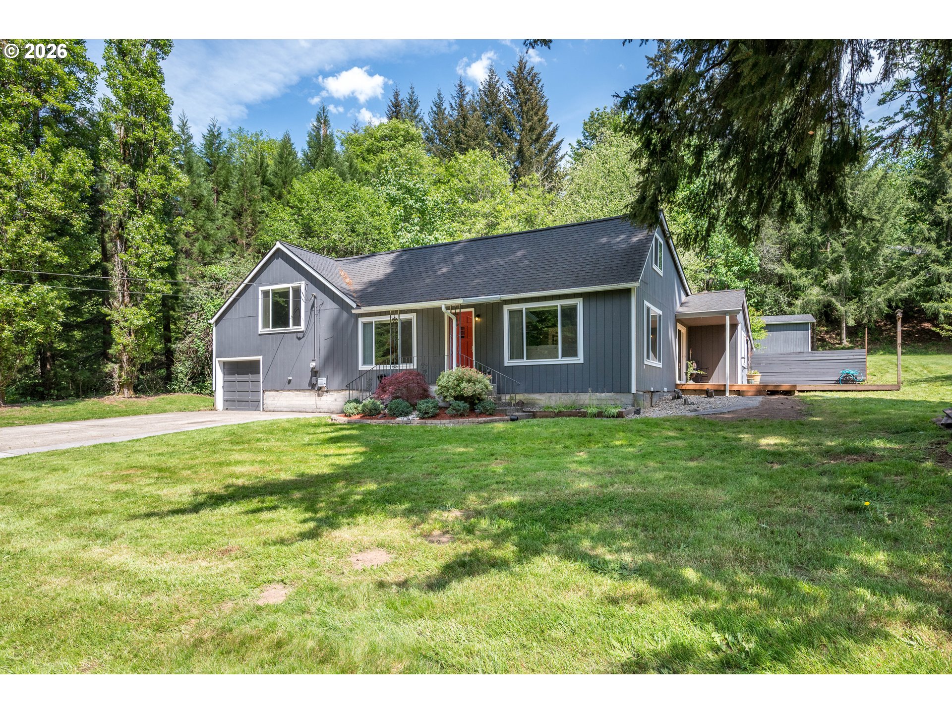 1304 Coal Creek Road Longview, WA 98632 - Photo 1 of 44 a front view of a house with a garden