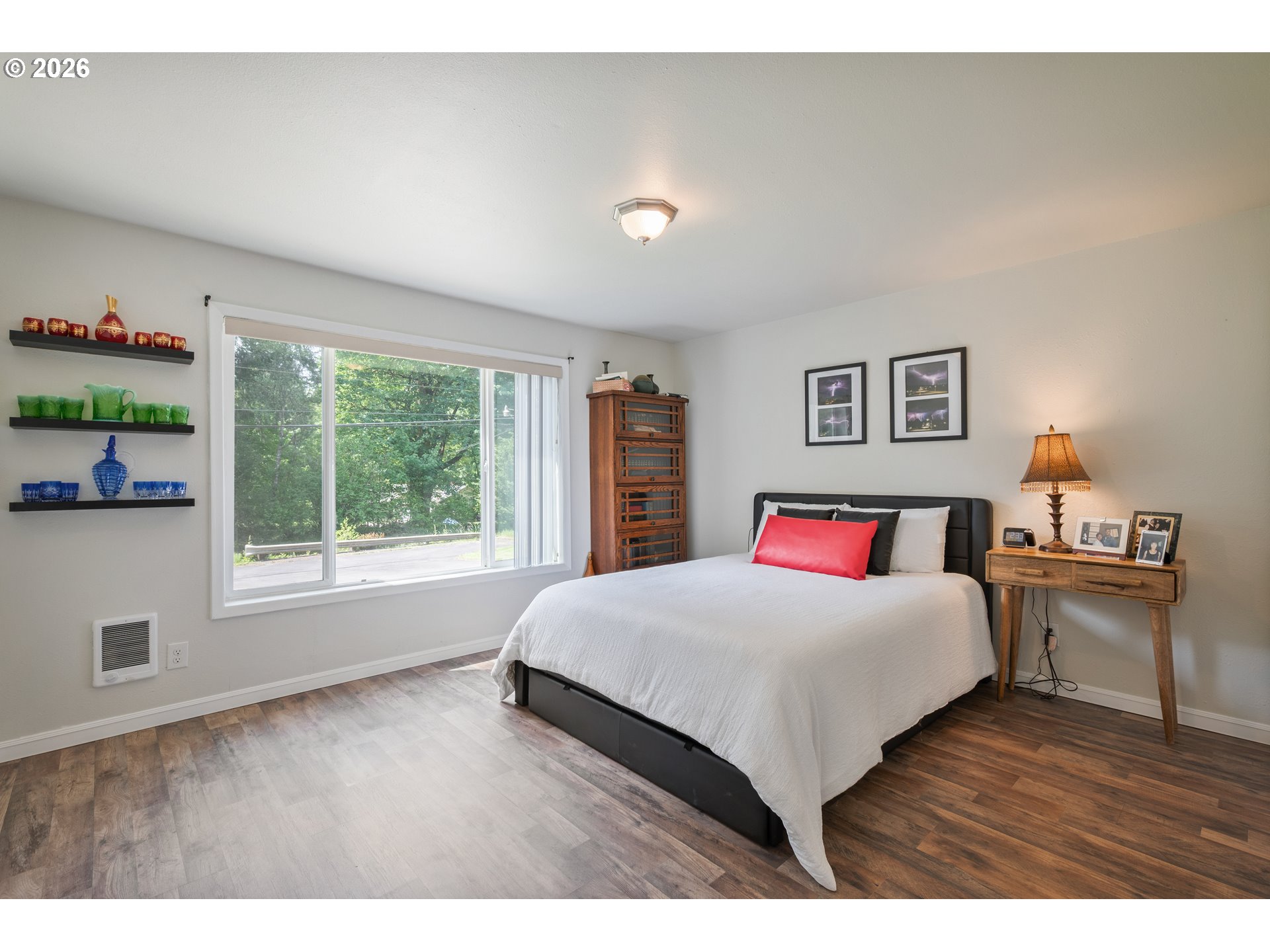 1304 Coal Creek Road Longview, WA 98632 - Photo 17 of 44 a bedroom with a large bed and a large window