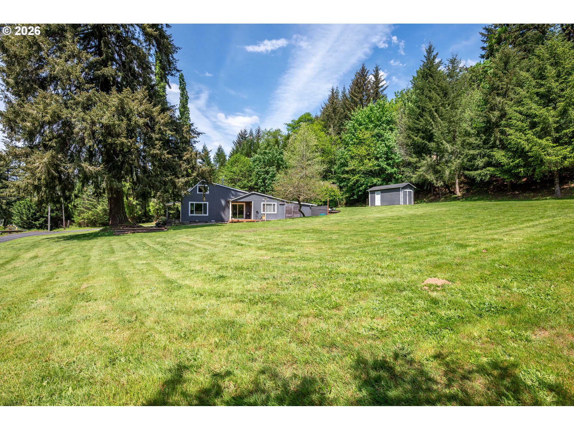 1304 Coal Creek Road Longview, WA 98632 - Photo 25 of 44 a backyard of a house with lots of green space
