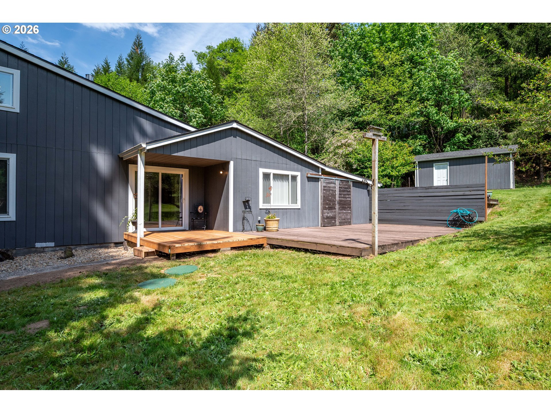 1304 Coal Creek Road Longview, WA 98632 - Photo 27 of 44 a view of a house with a yard and sitting area