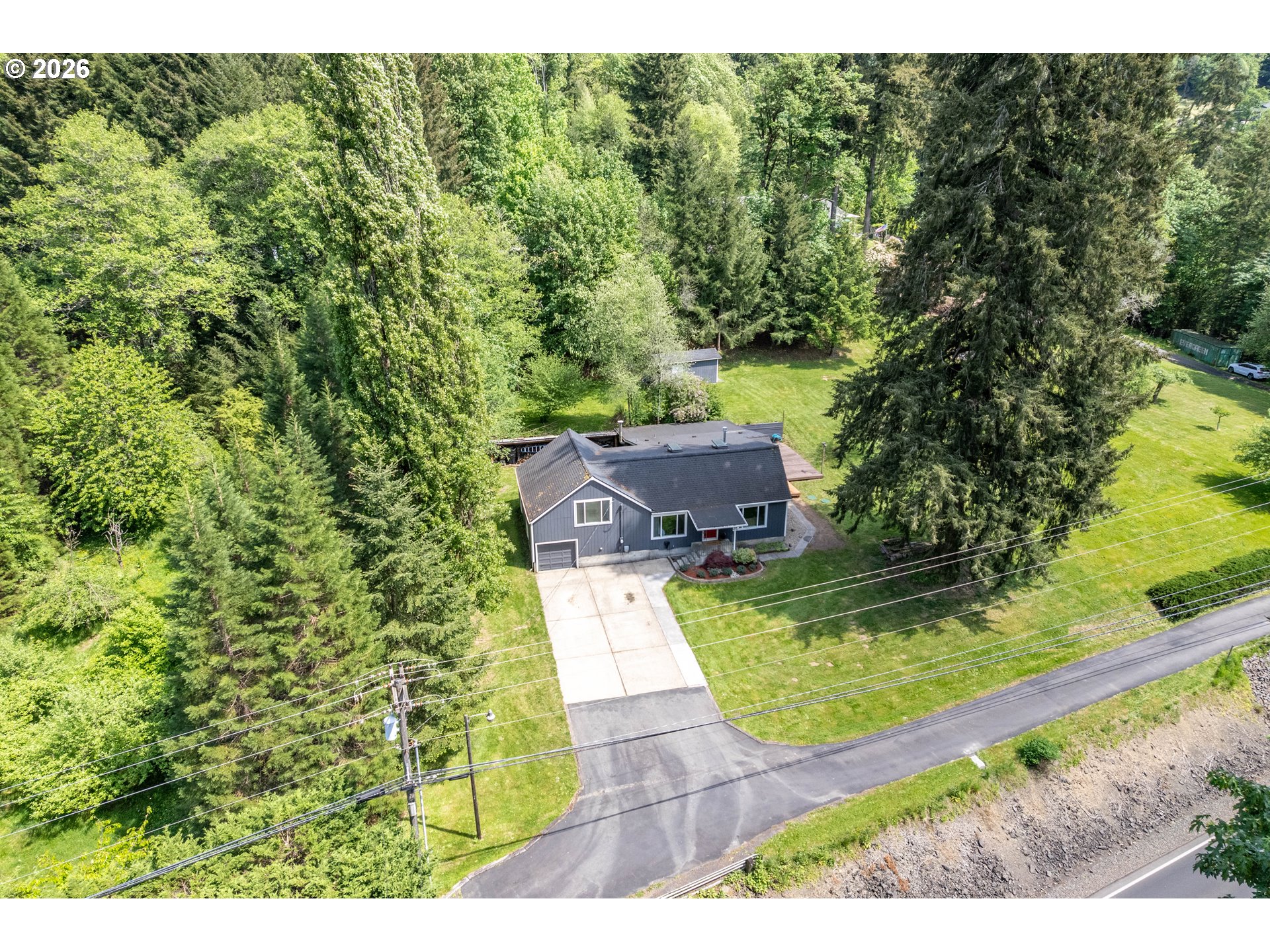 1304 Coal Creek Road Longview, WA 98632 - Photo 35 of 44 a view of a yard with an outdoor seating