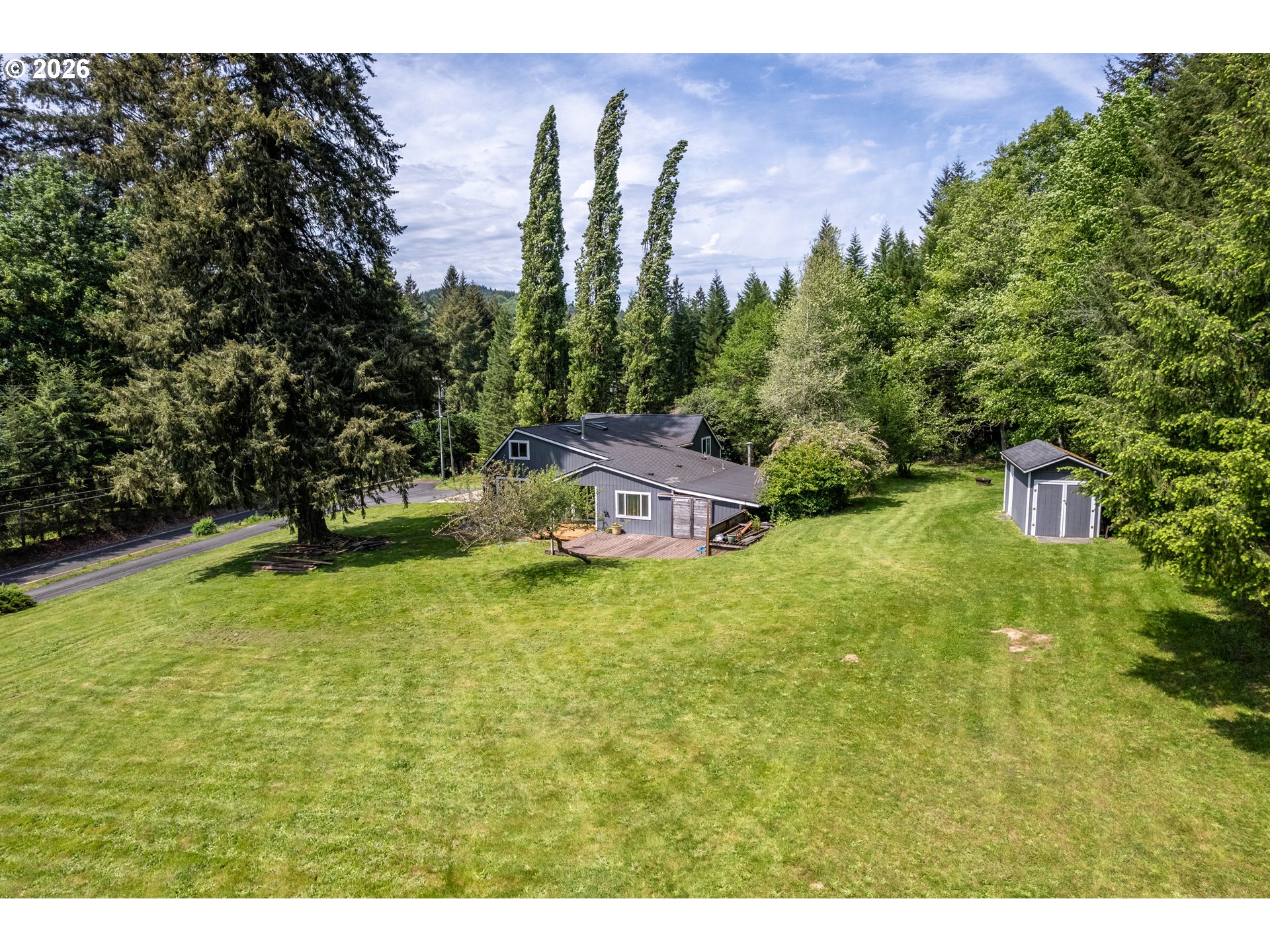 1304 Coal Creek Road Longview, WA 98632 - Photo 36 of 44 a backyard of a house with lots of green space