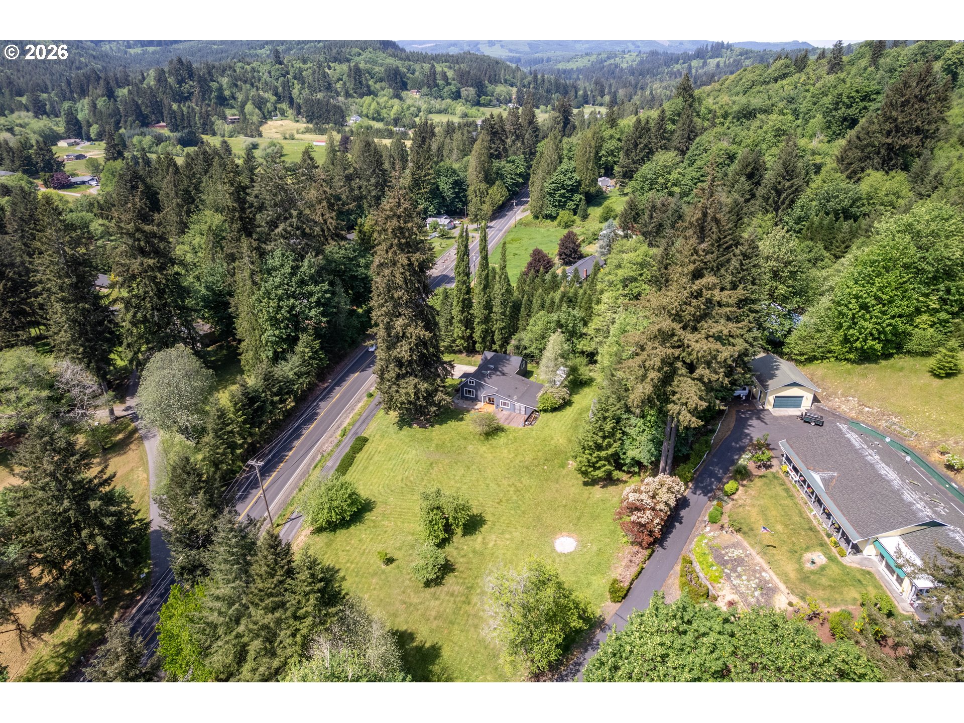 1304 Coal Creek Road Longview, WA 98632 - Photo 39 of 44 an aerial view of residential house with outdoor space and trees all around