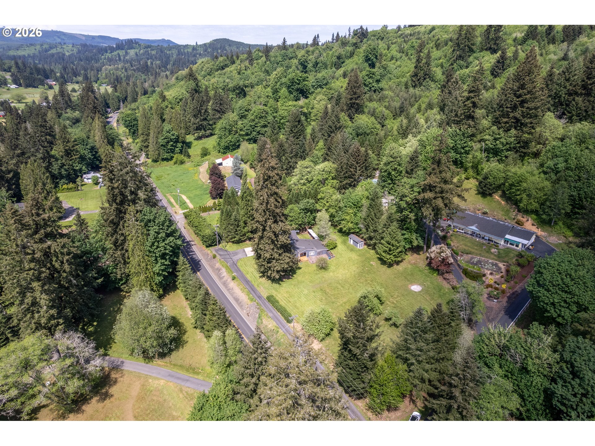 1304 Coal Creek Road Longview, WA 98632 - Photo 41 of 44 a view of a forest with a street